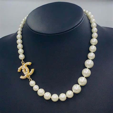 chanel black and gold necklace|Chanel necklace pearl price.